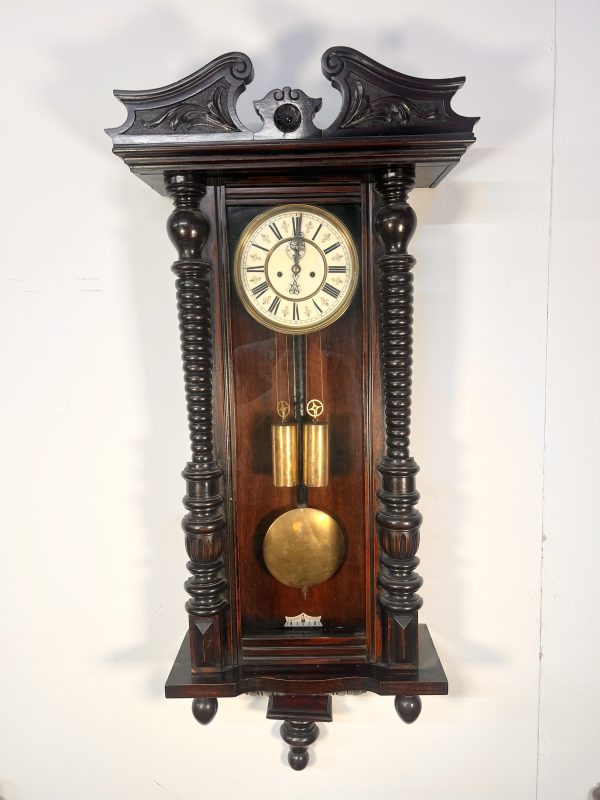 A 19th Century Walnut Cased Vienna Style Wall Clock With Twin Train Weight Driven Movement