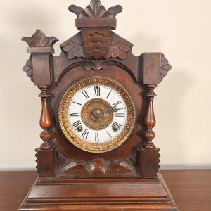 An Ansonia Twin Train Mantel Clock With A White Dial Chapter Ring